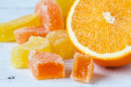 Slice of orange on wooden tableの写真素材