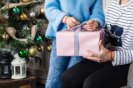 Young couple hold gift boxの写真素材