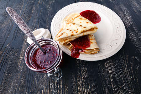 Russian blini pancakes and berry jam. Maslenitsa is an Eastern Slavic traditional holidayの写真素材