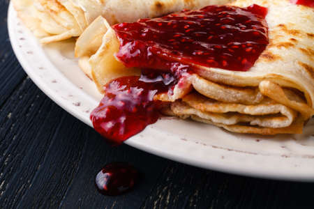 Russian blini pancakes and berry jam. Maslenitsa is an Eastern Slavic traditional holidayの写真素材