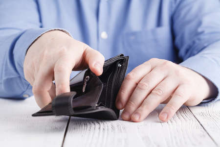 Empty wallet in man handsの写真素材