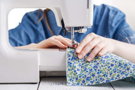 Tailor working on a sewing machineの写真素材