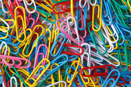 pile of colored office paper clipsの写真素材