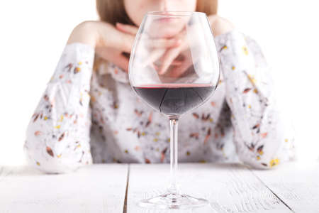 Young beautiful woman in depression, drinking alcoholの写真素材