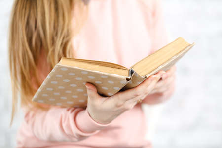 Female reading book, close upの写真素材