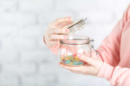 Female holg glass jar with jellyの写真素材