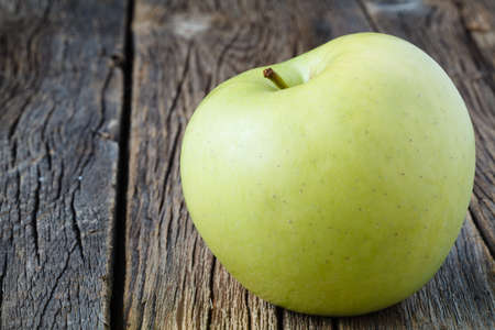 Sliced apple on rustic wooden table, close up viewの写真素材
