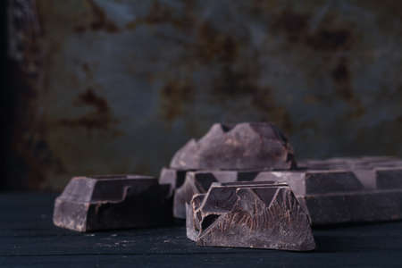 Crunch dark chocolat on rustic table