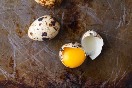 close up broken eggs with yellow yolkの写真素材