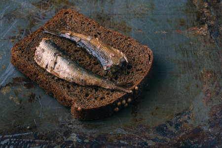 Open canned fish,fork and breadの写真素材