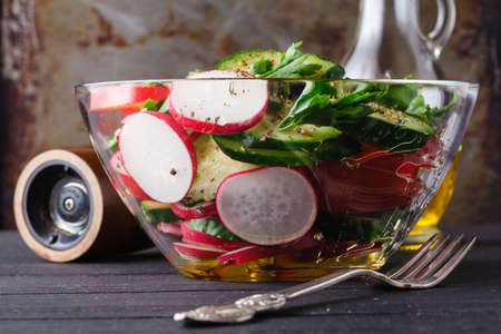 raw ingredients - cauliflower, potato, zucchini, carrot, onion, pepper, cooking roasted vegetables. On a dark wooden backgroundの写真素材