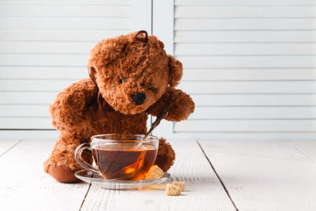 Tea cup with teddy bear, relax timeの写真素材