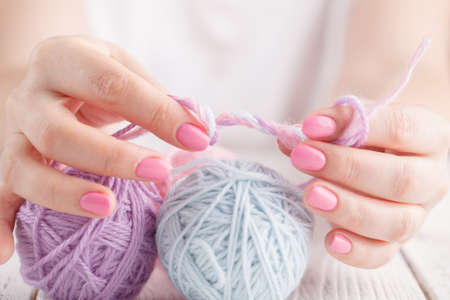 Knitting on the old boardの写真素材