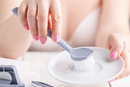 Modern kitchen - happy woman washing dishes, houseworkの写真素材