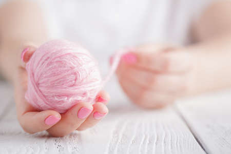 Wool clew in female handの写真素材