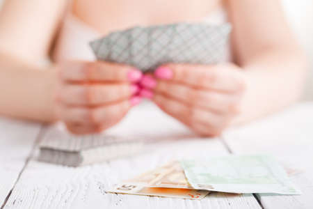 female gamble with play cardsの写真素材