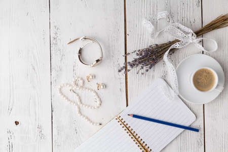 Envelope on white wooden table, flat lay, top viewの写真素材