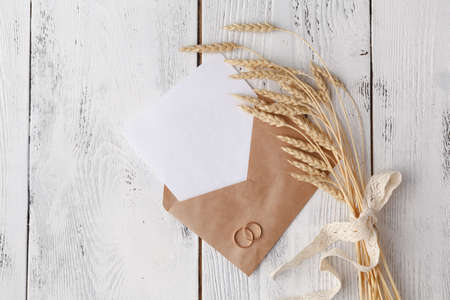 Paper blank, craft envelope on white background. Flat lay, top viewの写真素材