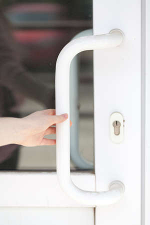 the girl opens the glass door