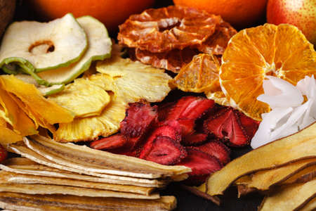 Close Up Of Organic Raw Sun Dried Fruits Pouring From Basket Mix Of Oranges, Plum, Strawberries,...