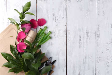 Florist background on white wooden table with copy spaceの写真素材