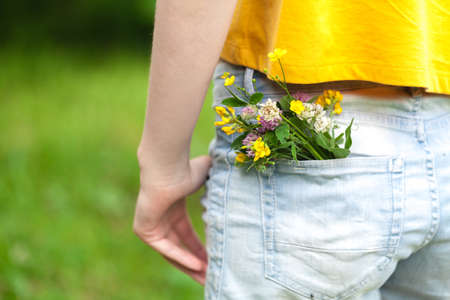 wild flowers in the blue jeans pocketの写真素材