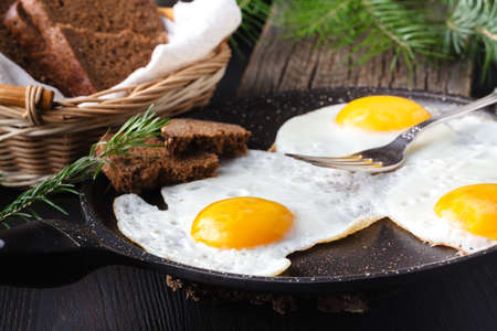 Fried eggs with toasts and drink, traditional breakfastの写真素材