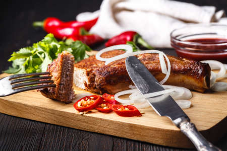 Christmas ham with spices and herbs on cutting board