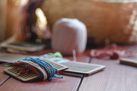 Yarn bundle weave zoom shot against the light showing its threads and yarns on the carpet loomの写真素材