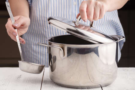 ladle and a pan on table