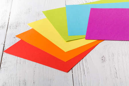 Designer desk with colored paper,の写真素材