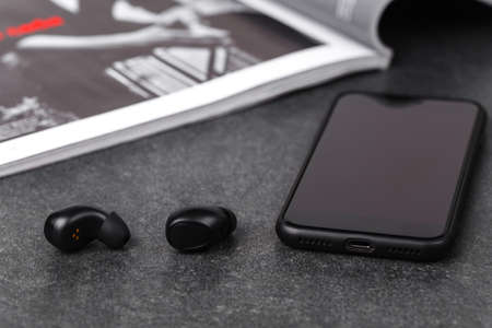 Bluetooth earphones for listen music in any weather on streetの写真素材