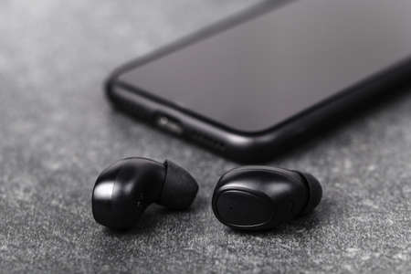 Bluetooth earphones for listen music in any weather on streetの写真素材