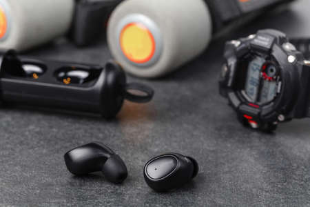 Cordless earphones with power box for long time listening musicの写真素材