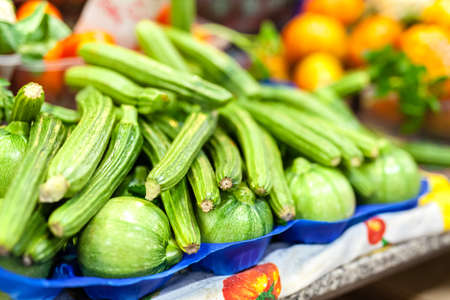Zucchini flower blossoms in a crate at an Italian farmers marketの写真素材