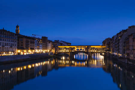 Famous bridge Ponte Vecchio on the river Arno in Florence, Italy. Evening viewの写真素材