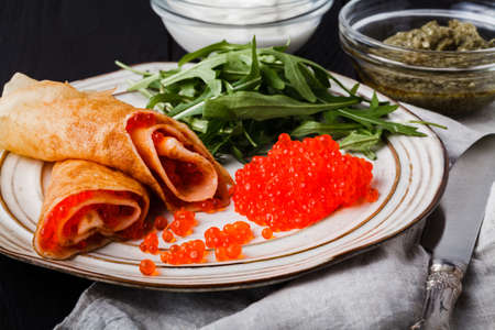 Delicious pancakes with red caviarの写真素材