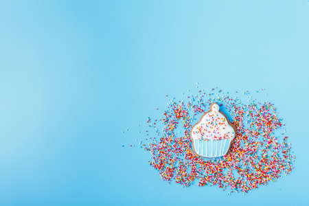 Multicolored Easter decorated cookies on a bright blue background