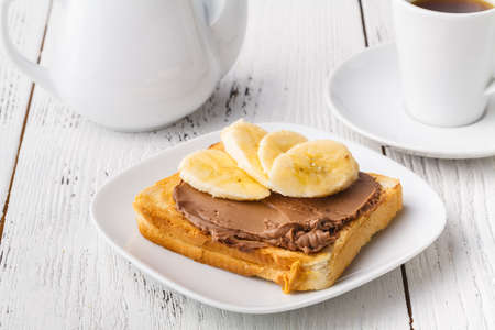 typical breakfast with toast and peanut butter at the hotelの写真素材