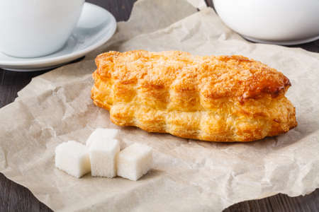Puff pastry apple pastry turnovers for dessert on a wooden tableの写真素材