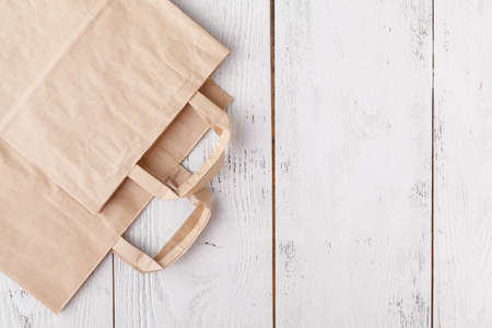 Shopping. Empty paper bags with handles, social responsibility, ecology care conceptの写真素材