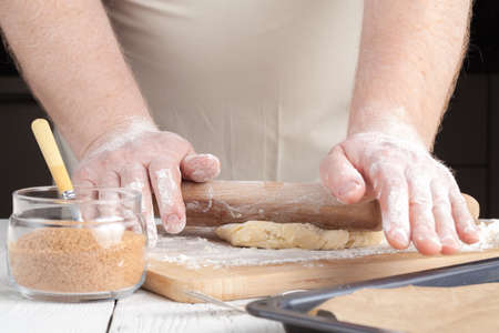 Making festive gingerbread dough on a baking sheetの写真素材