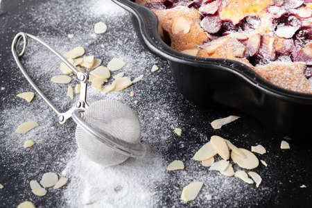 Breakfast concept, Homemade slice of shortbread dough raspberry pie with almond petalsの写真素材