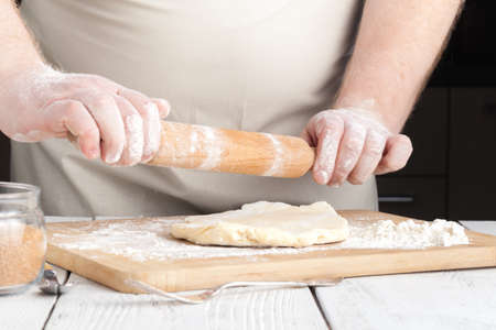 hands making dough on kitchen, close up viewの写真素材
