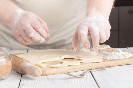 Making festive gingerbread dough on a baking sheetの写真素材