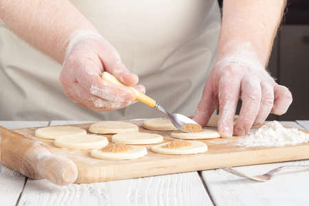 Baking christmas cookies on brown wooden tableの写真素材