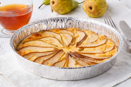 Puff pastry pies with cheese and pear in a plateの写真素材