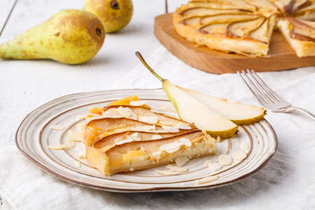 Puff pastry pies with cheese and pear in a plateの写真素材