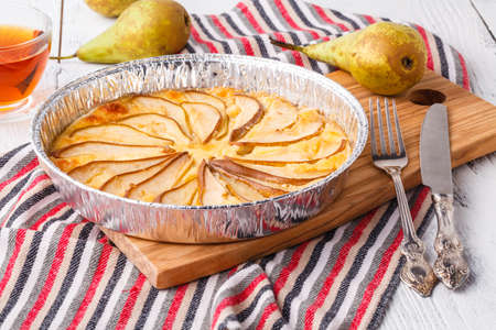 Puff pastry pies with cheese and pear in a plateの写真素材