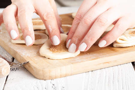 Baking christmas cookies on brown wooden tableの写真素材